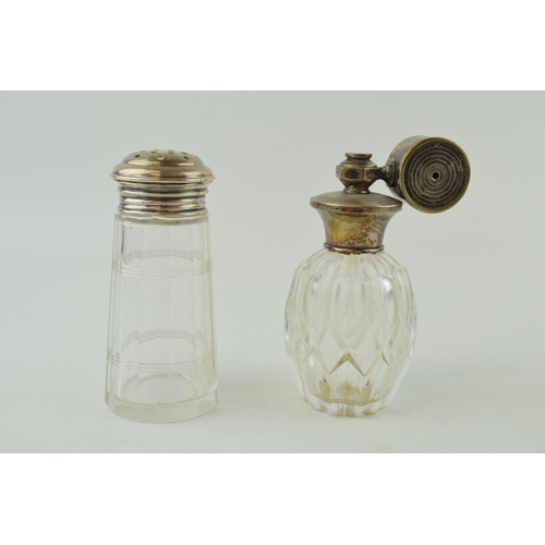 601 - A silver topped sugar shaker, stamped 'sterling' with a sterling silver topped atomiser (2), tallest... 