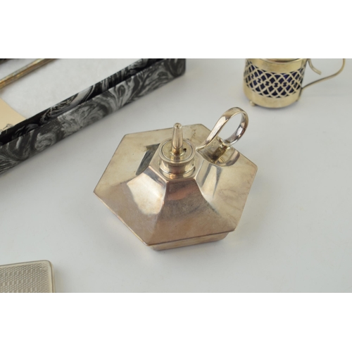 603 - Silver to include an oil candlestick, Birmingham 1942, with a case with engineered decoration, a mar... 