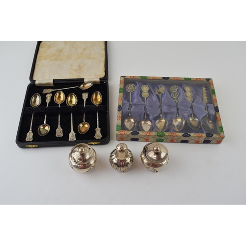 604 - A collection of Chinese silver items to include two sets of six spoons and a cruet set (one hinge af... 