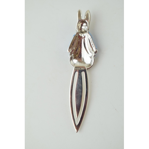 605 - Silver bookmark with Peter Rabbit with blue enamel coat, 7.5cm long.