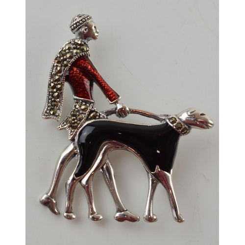 607 - Sterling silver Art Deco style brooch of a lady walking her dog, with enamelled decoration, 5.5cm ta... 