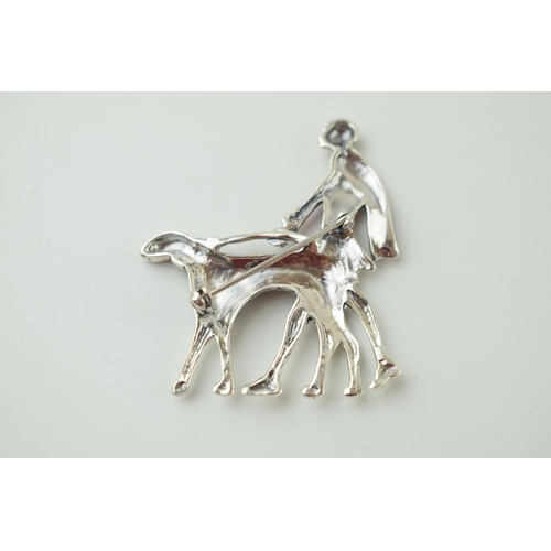 607 - Sterling silver Art Deco style brooch of a lady walking her dog, with enamelled decoration, 5.5cm ta... 