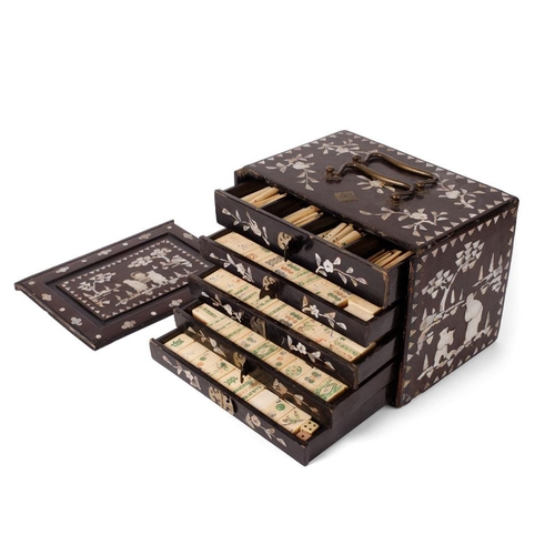 106 - A Mah-Jong set in original lacquered case with mother of pearl inlaid design. Four internal drawers ... 