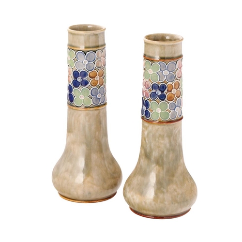 178 - A pair of Royal Doulton Stoneware vases, with stylized flowers, low shouldered, 26cm tall, by Florri... 