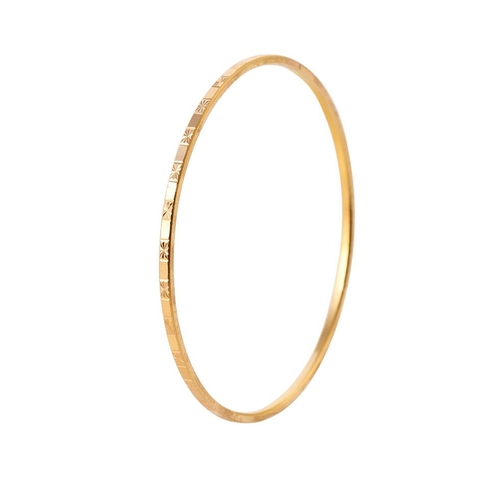 218 - Yellow metal (tests as 18ct or better) circular bangle with engraved decoration, 62mm diameter, 11 g... 