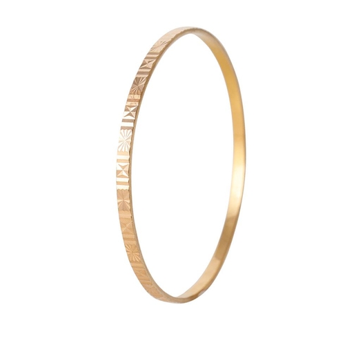 220 - Yellow metal (tests as 18ct or better) circular bangle with engraved decoration, 61mm diameter, 11.1... 