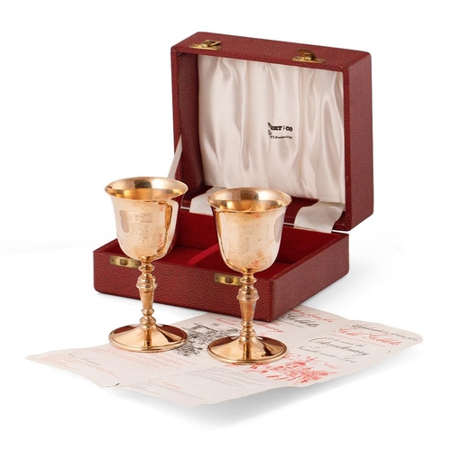 233 - A pair of hallmarked 9ct gold goblets, in presentation case, to commemorate the Octocentenary of New... 