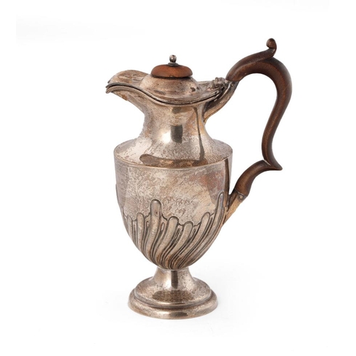 268 - Hallmarked silver water jug, with ribbed swirling decoration, wooden handle, Birmingham 1901, 21cm t... 