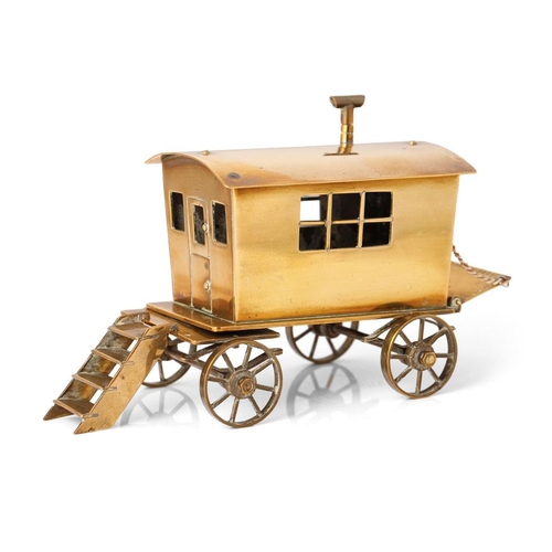 77 - A scratch-built gypsy caravan / showman's wagon in brass. c1930s. Detailed model with moving wheels,... 