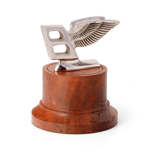 87 - Bentley mascot mounted on a burr wood base professionally tuned by a Rolls Royce craftsman. Height 1... 