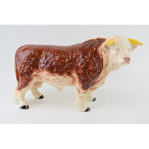 136 - A large mid 20th century butchers shop advertising figure of a Hereford Bull, with horns, 42cm long,... 