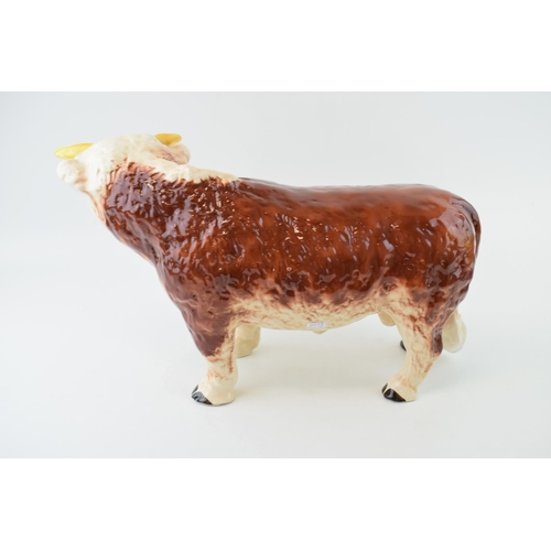 136 - A large mid 20th century butchers shop advertising figure of a Hereford Bull, with horns, 42cm long,... 