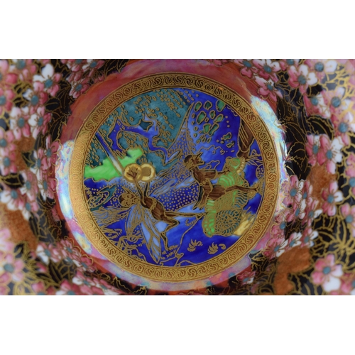 140 - Wedgwood fairyland lustre footed bowl, designed by Daisy Makeig Jones, the centre panel decorated wi... 