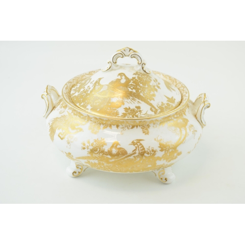 154 - Royal Crown Derby lidded tureen in the 'Gold Aves' pattern, raised on scroll feet, 22.5cm wide.