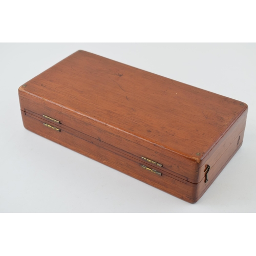 20 - Mahogany cased travel chess set with bone pieces. Case is hinged and folds for transportation.