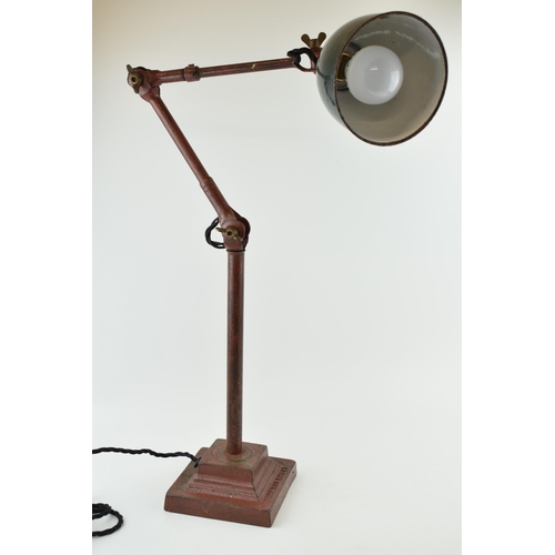 34 - An early 20th century 'Dugdills' machinist’s lamp, raised on a loaded plinth with DUGDILLS name in c... 