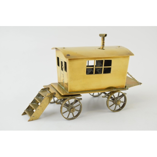 77 - A scratch-built gypsy caravan / showman's wagon in brass. c1930s. Detailed model with moving wheels,... 