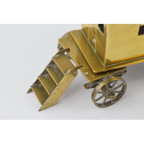 77 - A scratch-built gypsy caravan / showman's wagon in brass. c1930s. Detailed model with moving wheels,... 