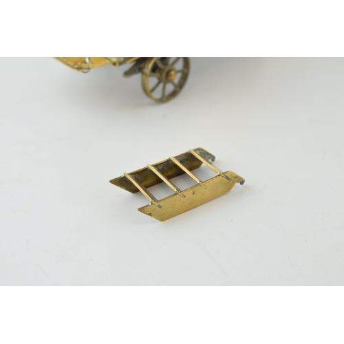 77 - A scratch-built gypsy caravan / showman's wagon in brass. c1930s. Detailed model with moving wheels,... 