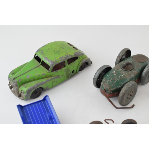 84 - A collection of tinplate and clock work toys by manufacturers such as METTOY and other pre-war examp... 