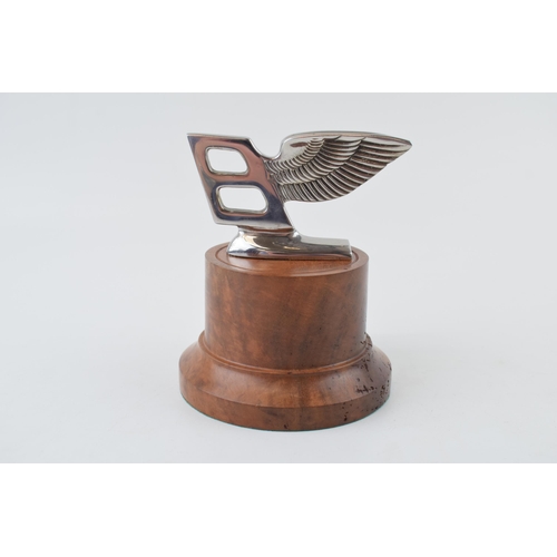 87 - Bentley mascot mounted on a burr wood base professionally tuned by a Rolls Royce craftsman. Height 1... 