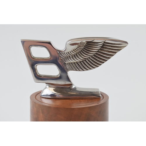 87 - Bentley mascot mounted on a burr wood base professionally tuned by a Rolls Royce craftsman. Height 1... 