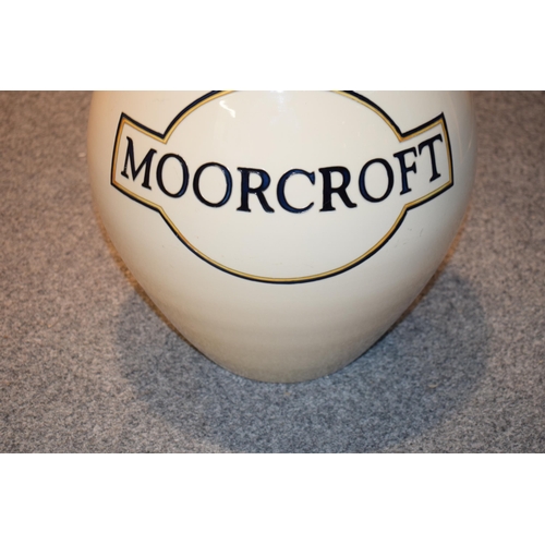 162 - An extra large Moorcroft ovoid vase decorated with the Moorcroft logo, an advertising vase / point o... 