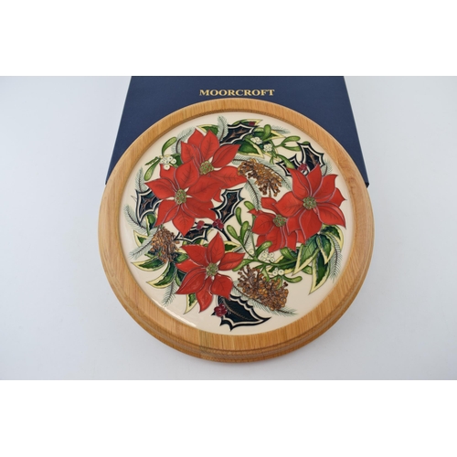 166 - Boxed Moorcroft charger 'Festive Feelings' in light oak frame, signed by Helen Dale, 30.5cm wide.