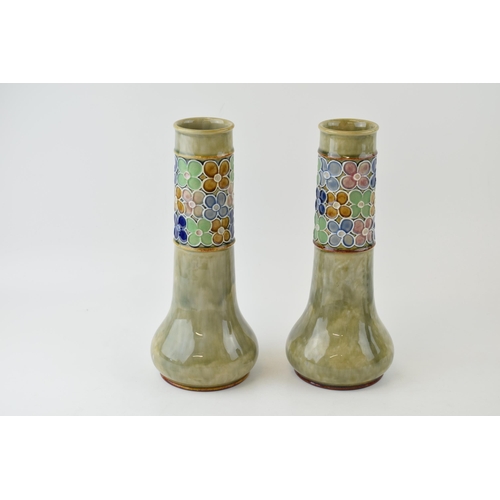 178 - A pair of Royal Doulton Stoneware vases, with stylized flowers, low shouldered, 26cm tall, by Florri... 