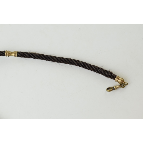 215 - Early Victorian mourning albert watch chain made with finely plaited hair and metal mounts, with wat... 