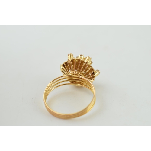 225 - Yellow metal (tests as 18ct or better) ring, floral head set with white stones, with textured leaf d... 