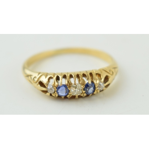 228 - Yellow metal (tests as 18ct) ring, set diamond and sapphire, size M, 2.8g.