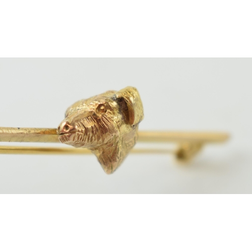 232 - 9ct gold bar brooch with gold dog's head, 5.3g, 52mm wide.