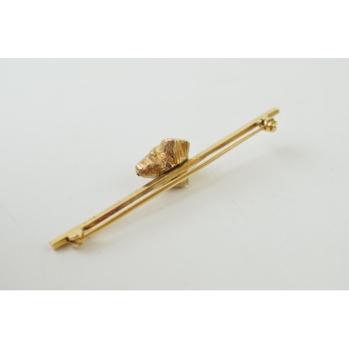 232 - 9ct gold bar brooch with gold dog's head, 5.3g, 52mm wide.