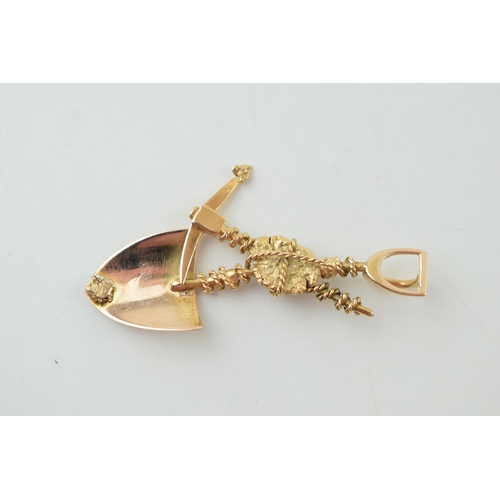 237 - 9ct gold pendant, in the form of a miner's tools such as a spade and a pick axe, 3.9g, 47mm wide, te... 