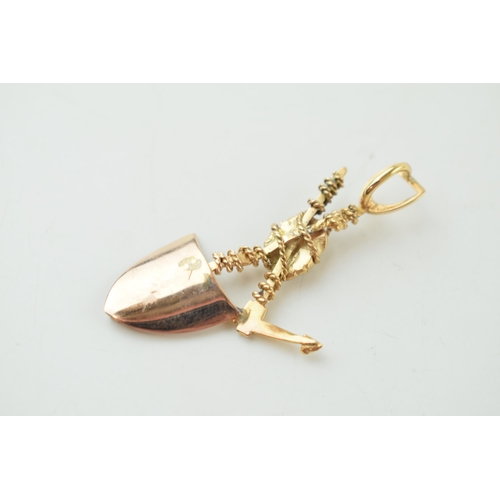 237 - 9ct gold pendant, in the form of a miner's tools such as a spade and a pick axe, 3.9g, 47mm wide, te... 