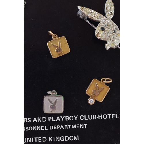 239 - A collection of 'Playboy' jewellery and ephemera to include 'Playboy Service Award' pendants in, sil... 