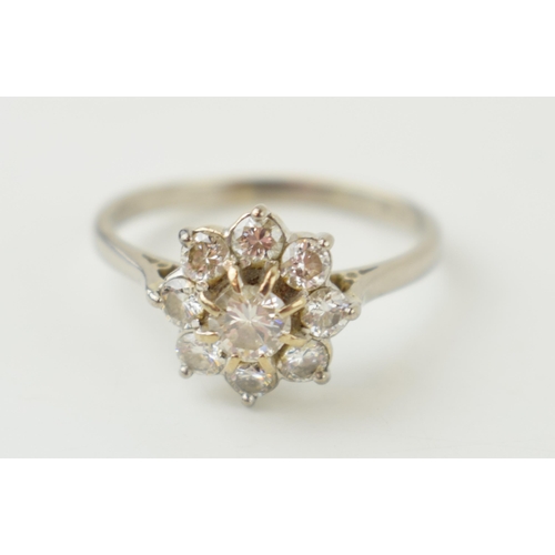 240 - 18ct white gold 'Daisy Cluster' ring, set diamonds, combined 0.7ct. Ring size 'S'. Gross weight 3.9 ... 