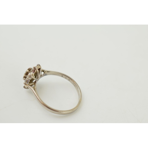 240 - 18ct white gold 'Daisy Cluster' ring, set diamonds, combined 0.7ct. Ring size 'S'. Gross weight 3.9 ... 