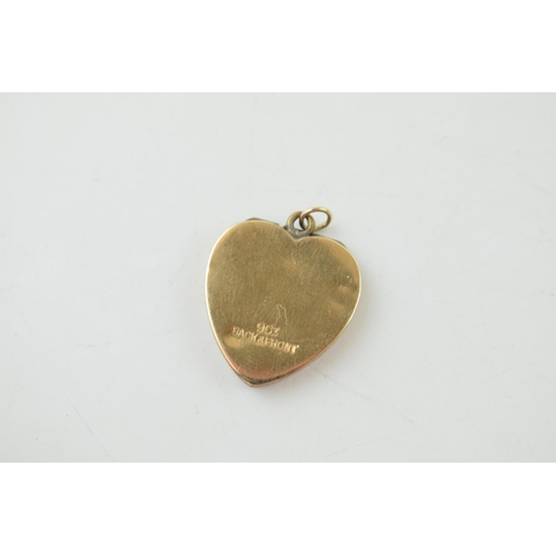 250 - 9ct yellow gold (front and back) heart shaped locket. Gross weight 3.1 grams.