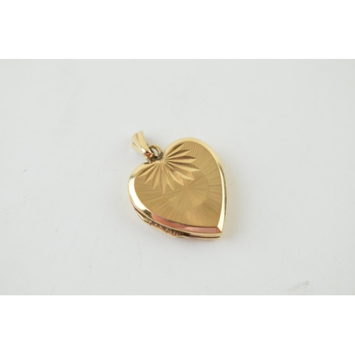 255 - 9ct yellow gold (back and front) heart shaped locket. Gross weight 2.6 grams.