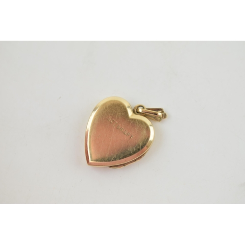 255 - 9ct yellow gold (back and front) heart shaped locket. Gross weight 2.6 grams.