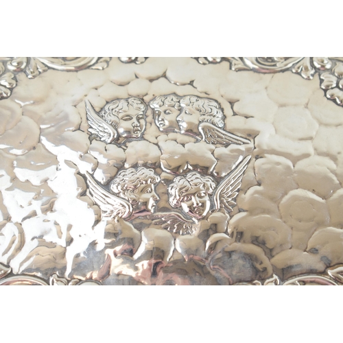 263 - Hallmarked silver tray with shaped edge in the Reynold's Angel pattern, 386.7 grams, Birmingham 1903... 