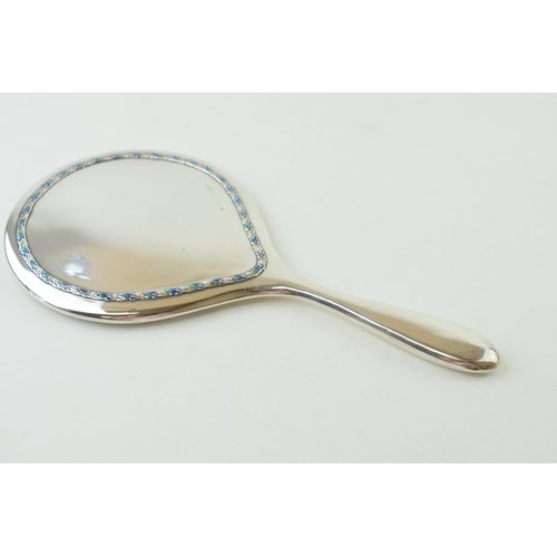 264 - Liberty & Co silver hand mirror, with enamelled decoration on applied foliate border, numbered '5692... 