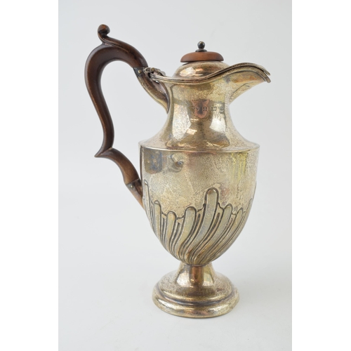 268 - Hallmarked silver water jug, with ribbed swirling decoration, wooden handle, Birmingham 1901, 21cm t... 