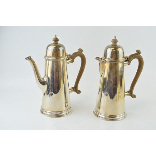 278 - Hallmarked silver coffee pot with a matching silver hot water jug, both with wooden handles and fini... 