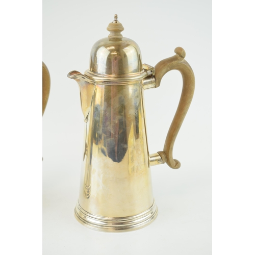 278 - Hallmarked silver coffee pot with a matching silver hot water jug, both with wooden handles and fini... 