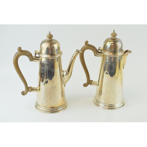 278 - Hallmarked silver coffee pot with a matching silver hot water jug, both with wooden handles and fini... 