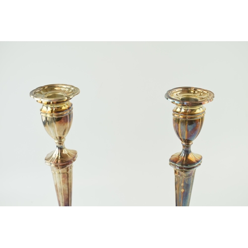 282 - A pair of large silver candlestick, shaped weighted bases, ribbed design, 30.5cm tall (2), Sheffield... 