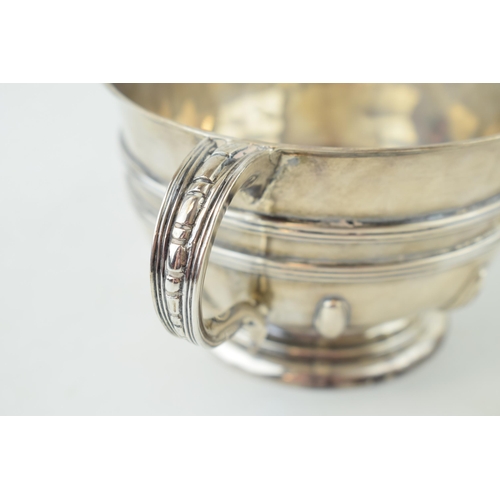 285 - Hallmarked silver twin handled pedestal bowl, with ribbed decoration, large outreaching handles, Lon... 